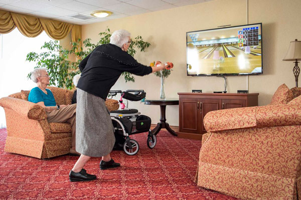Seniors playing video games at the best retirement residence in Oakville, ON